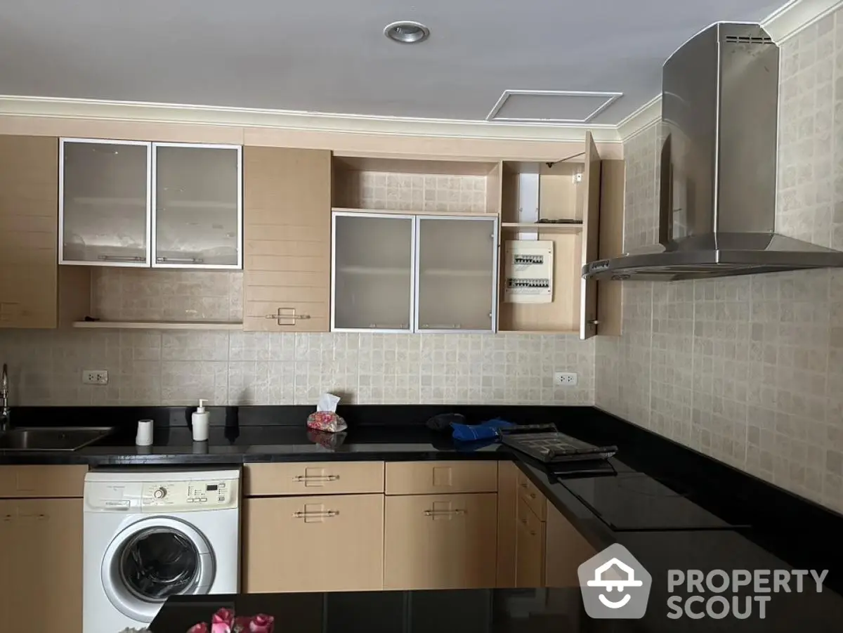 Modern kitchen with sleek cabinets and built-in appliances