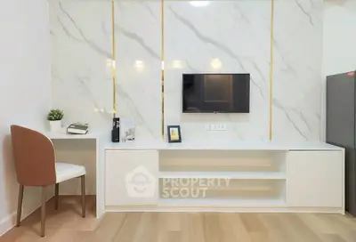Modern living room with sleek TV unit and marble accent wall