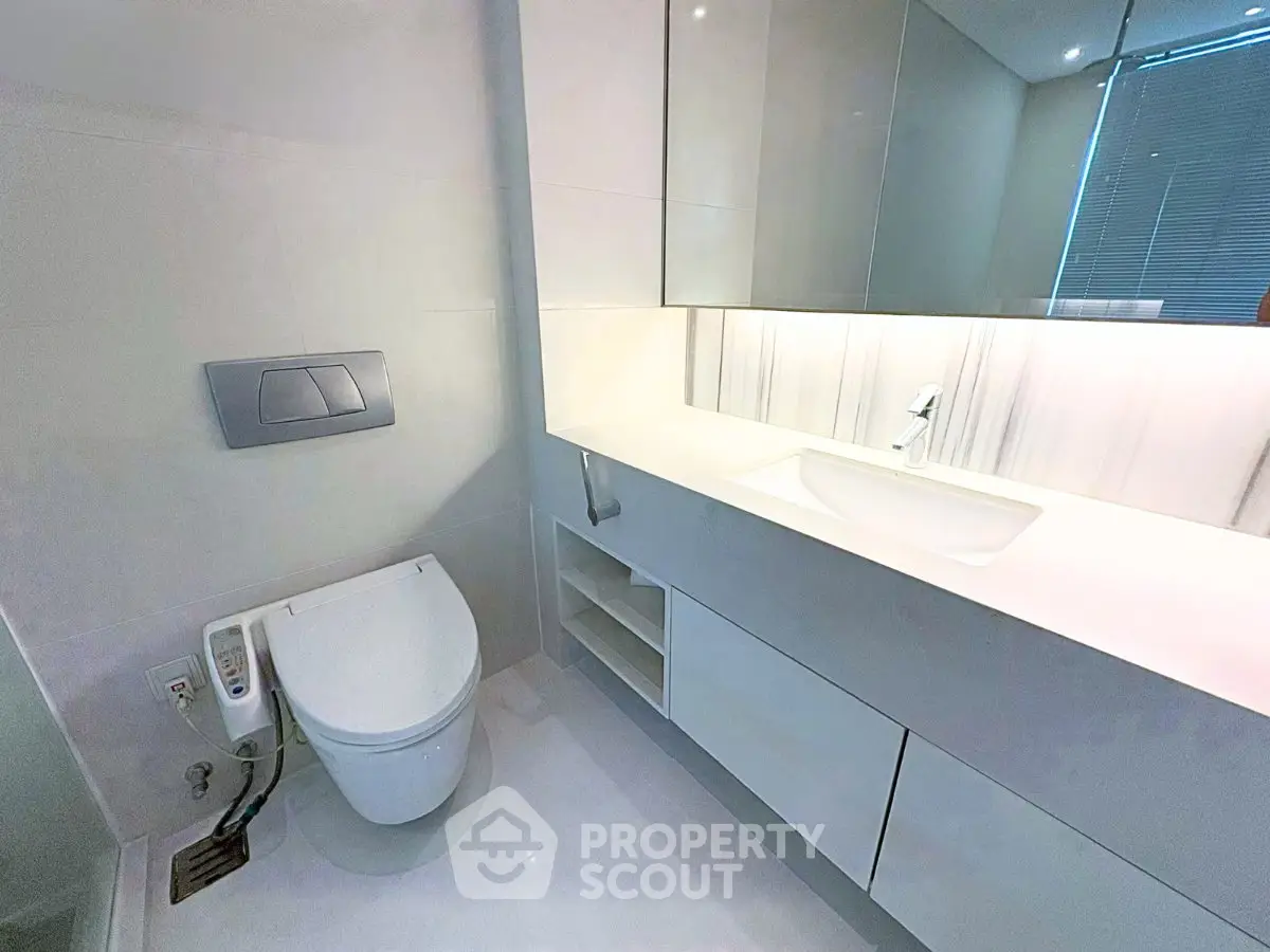 Modern bathroom with sleek fixtures and integrated storage solutions