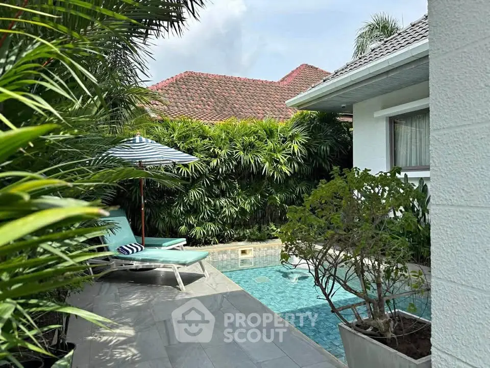 Luxurious private villa with pool and lush greenery, perfect for relaxation and tropical living.