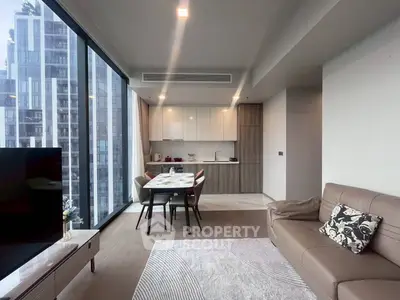 Modern living room with open kitchen and city view in luxury apartment