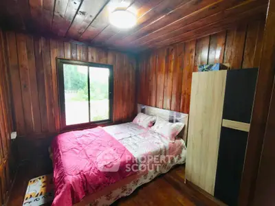 Cozy wooden bedroom with natural light and stylish decor