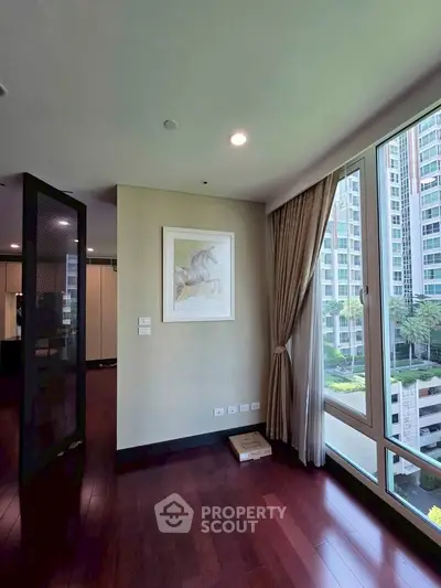 Spacious corner unit with large windows offering a stunning view of the cityscape, perfect for modern living.