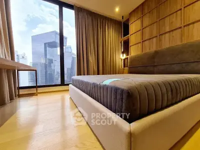 Luxurious bedroom with stunning city view and modern design in high-rise apartment.