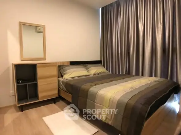 Cozy bedroom with modern decor and elegant curtains