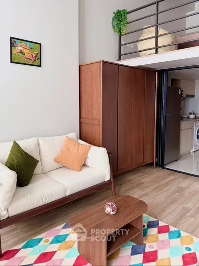 Modern loft apartment with cozy living area and stylish kitchen