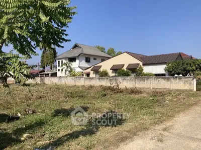 Spacious plot with potential for development near residential homes.