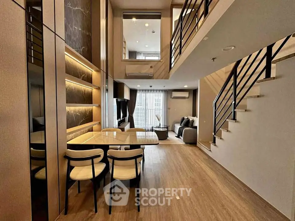 Modern duplex living room with stylish decor and open layout