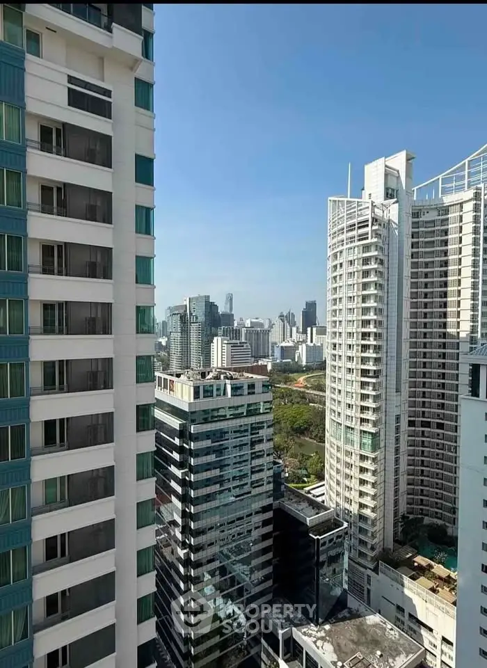 Stunning cityscape view from high-rise building balcony in urban skyline.
