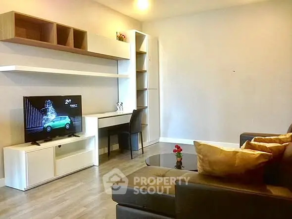 Modern living room with sleek furniture and built-in shelving, perfect for stylish urban living.