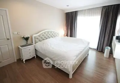 Spacious and elegant bedroom with natural light and modern decor