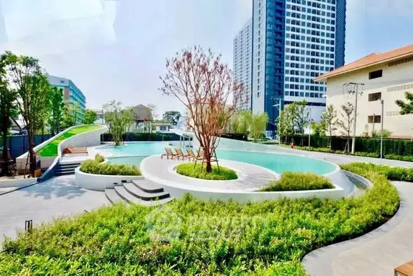 Luxurious residential complex with stunning pool and lush landscaping