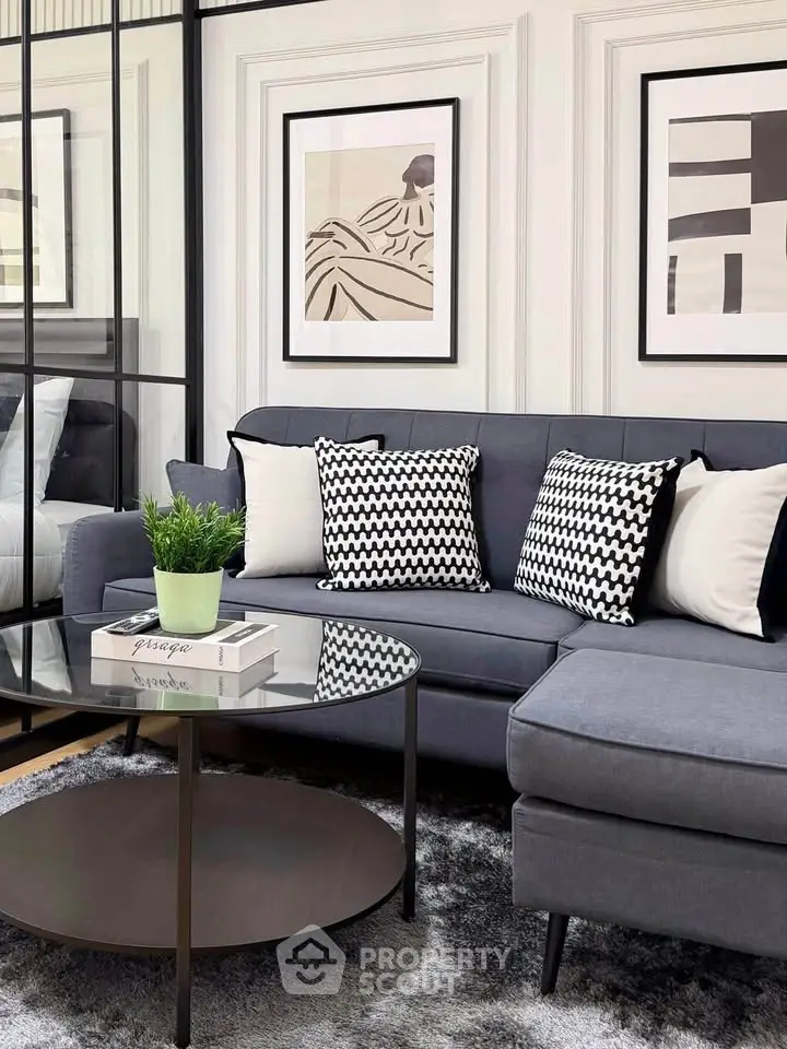 Stylish modern living room with gray sectional sofa and chic decor