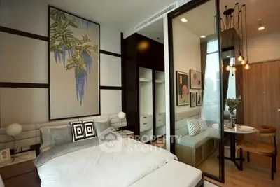 Modern bedroom with stylish decor and cozy dining nook in a chic apartment.