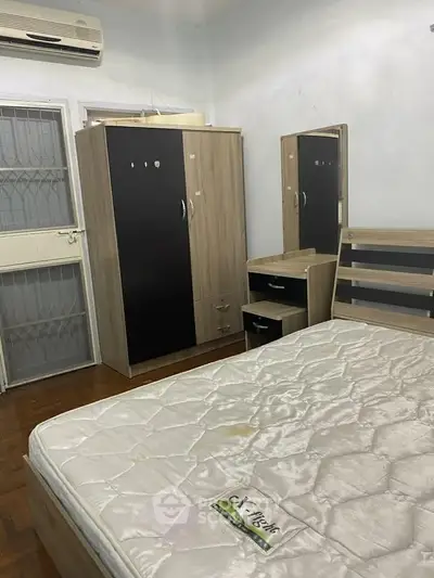 Cozy bedroom with modern furniture and air conditioning, perfect for comfort and relaxation.