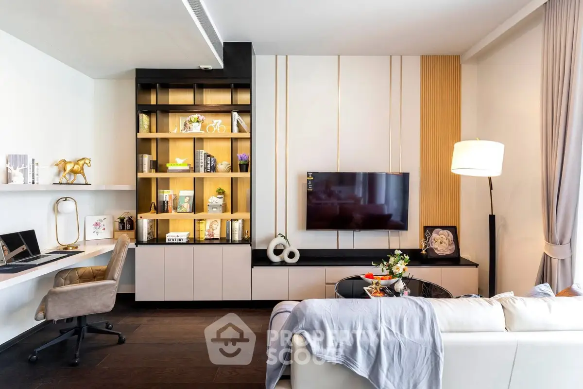 Modern living room with stylish decor, built-in shelves, and wall-mounted TV