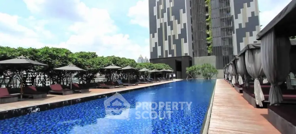 Luxurious rooftop pool with modern design and city views, perfect for relaxation and leisure.