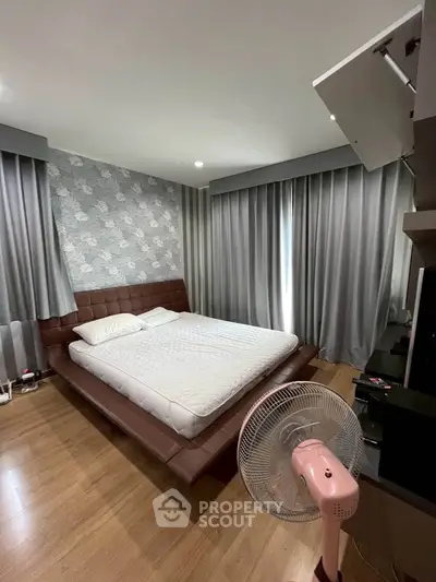 Cozy bedroom with modern decor and stylish curtains