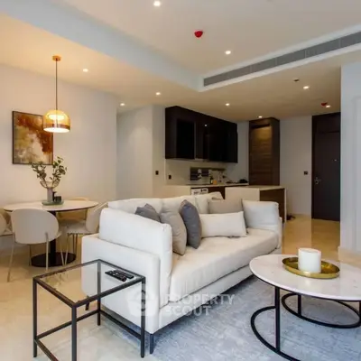 Modern open-plan living room with elegant decor and cozy seating area