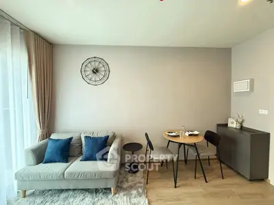 Modern living room with cozy sofa and dining area, perfect for relaxation.