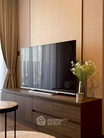 Elegant living room with modern TV setup and stylish decor