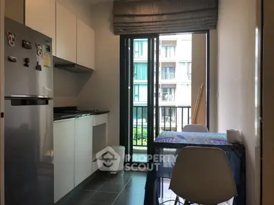 Modern kitchen with balcony view in stylish apartment