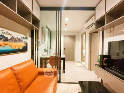 Modern living room with orange sofa and glass partition in stylish apartment
