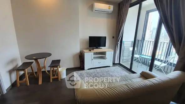Modern living room with balcony view in high-rise apartment