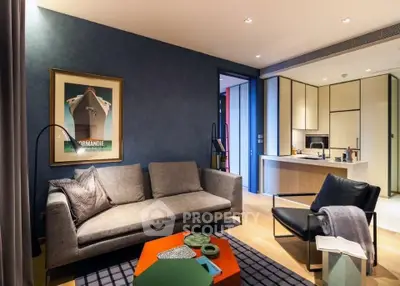 Modern living room with stylish furniture and open kitchen layout, perfect for contemporary urban living.