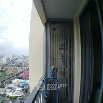 High-rise balcony with city view, perfect for urban living enthusiasts.