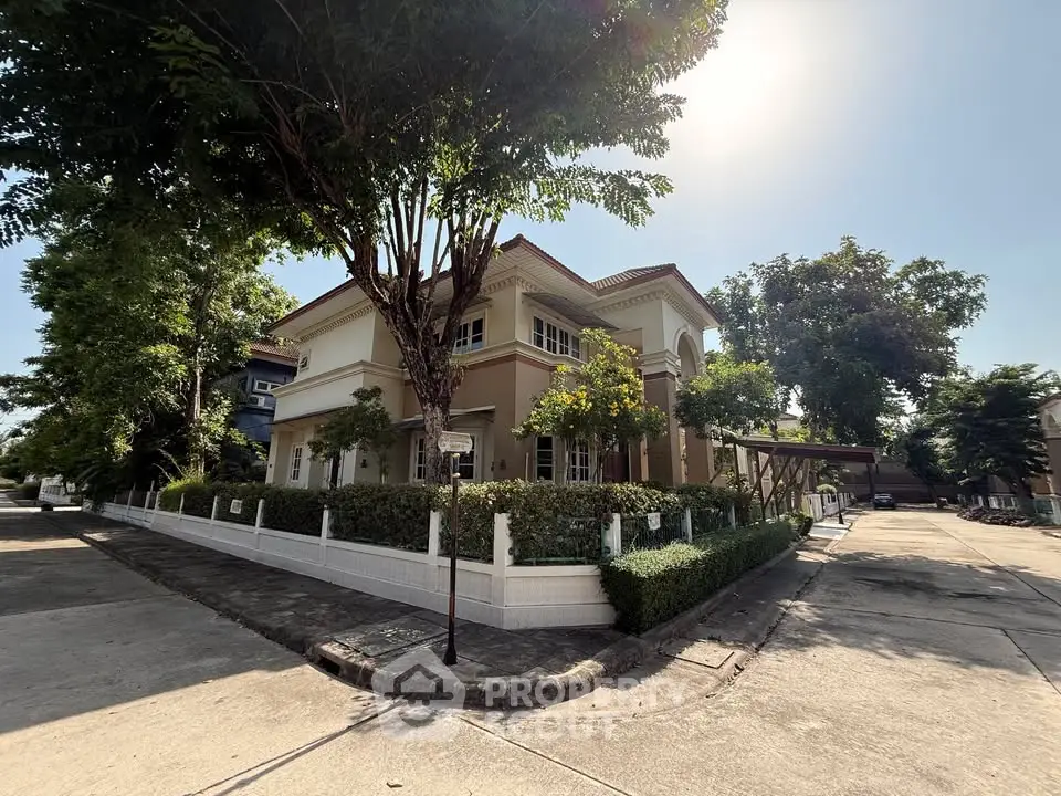 Charming two-story house with lush garden and spacious driveway in serene neighborhood.