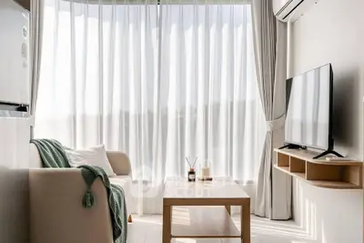 Bright and airy living room with modern decor and large window