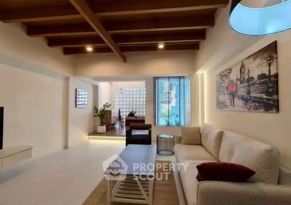 Spacious living room with modern decor and cozy seating area