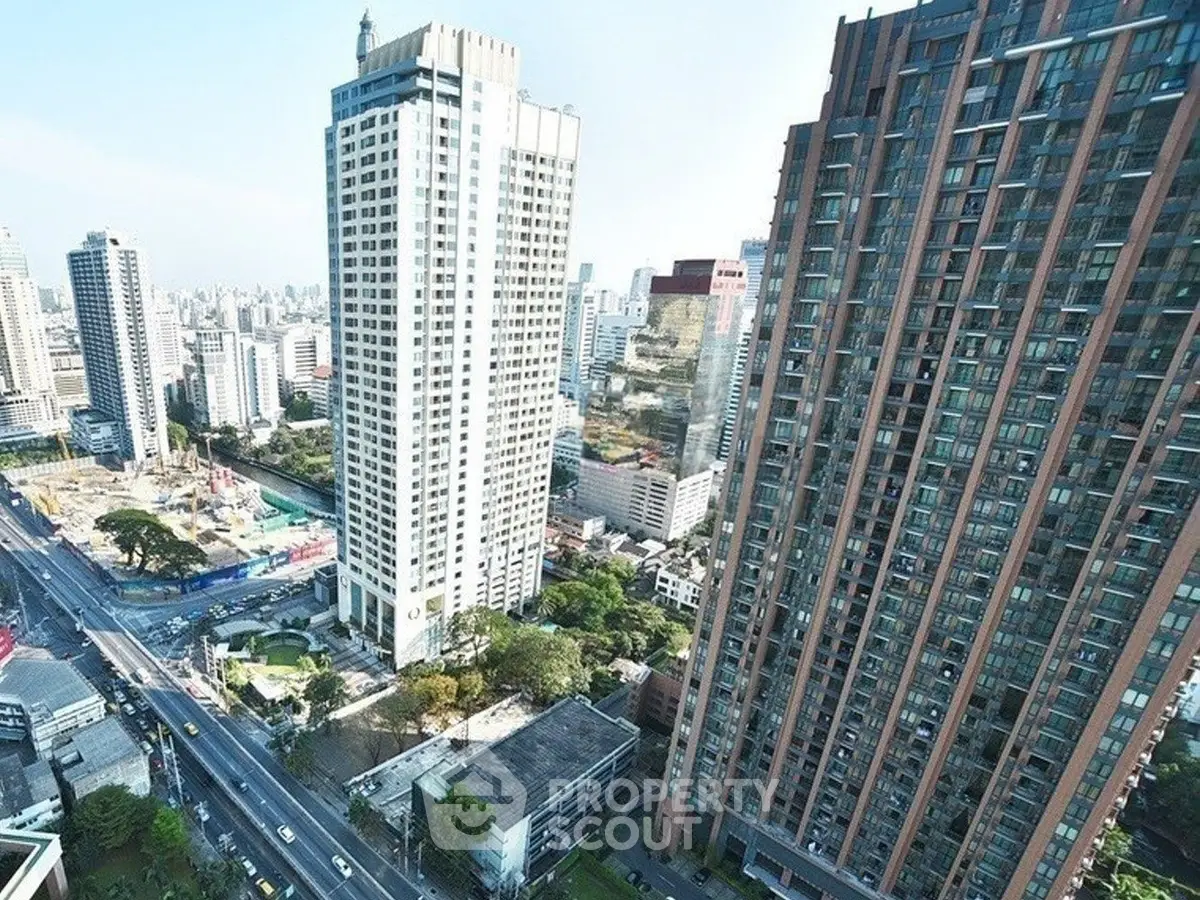 Stunning cityscape view with modern high-rise buildings and vibrant urban life.