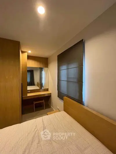 Cozy bedroom with wooden furniture and modern design