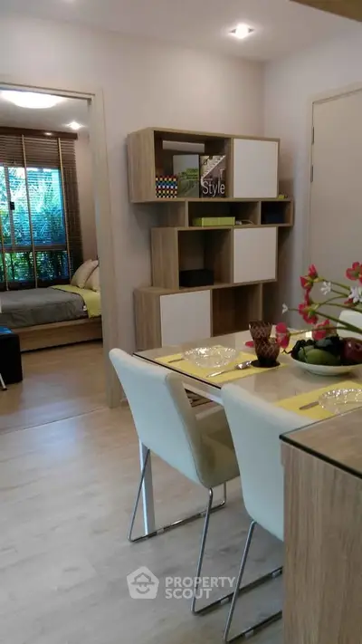 Modern open-plan living and dining area with stylish decor and natural light.