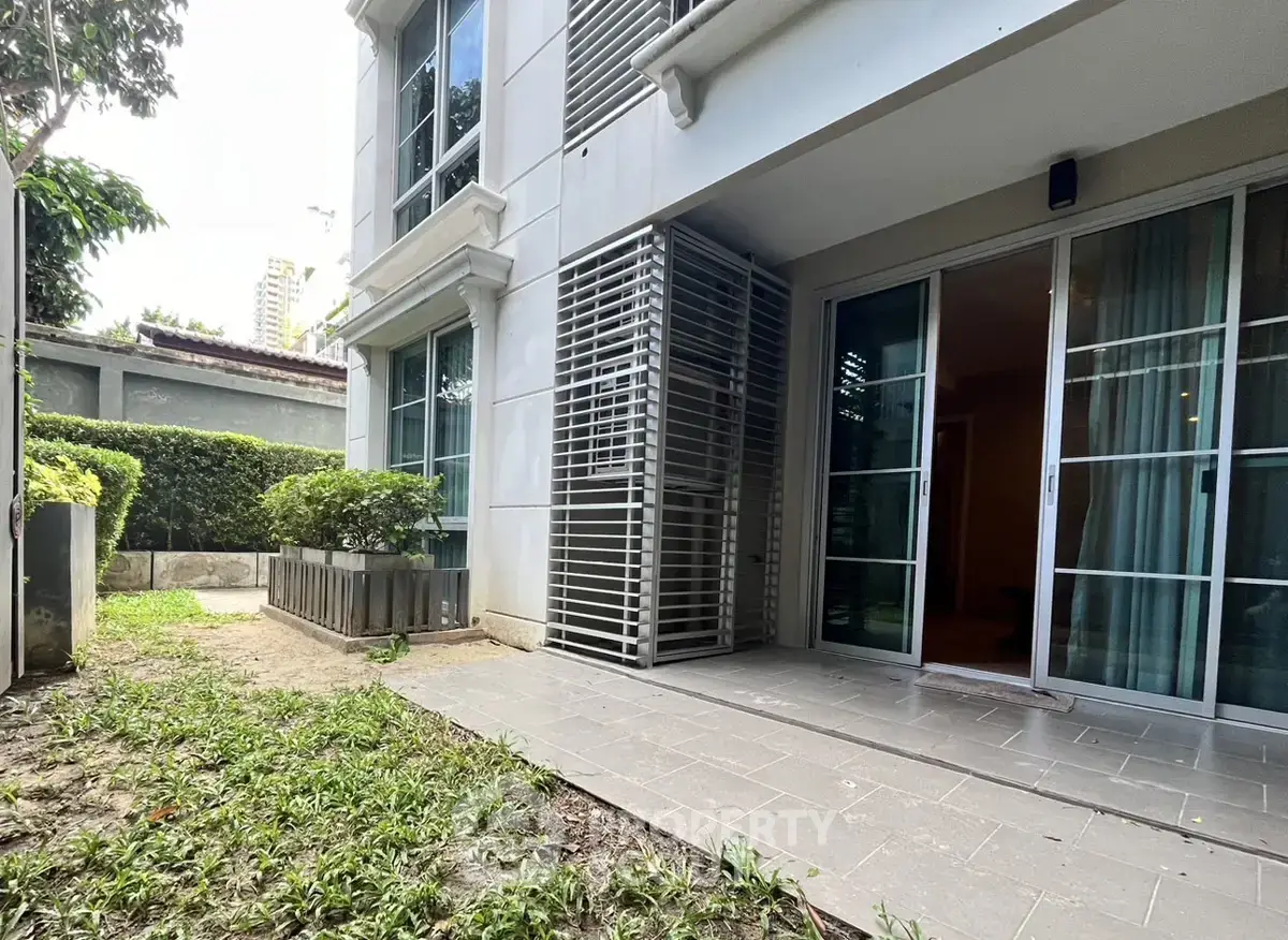 Spacious ground floor unit with private garden and modern sliding glass doors.