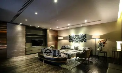 Luxurious modern living room with elegant furniture and ambient lighting.