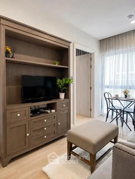Charming living room with cozy seating and elegant wooden furniture, perfect for relaxation and entertainment.