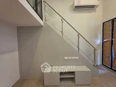 Modern interior with staircase and air conditioning in a stylish apartment