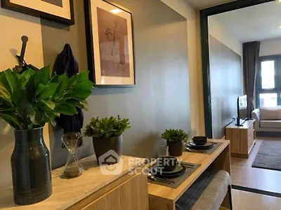 Modern living room with stylish decor and open layout, featuring cozy seating and elegant dining area.