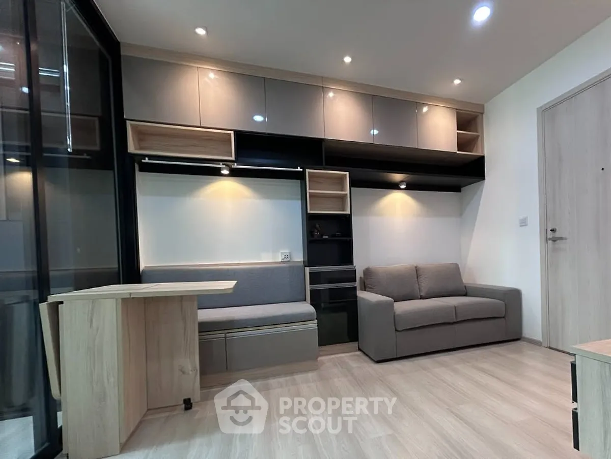 Modern living room with sleek furniture and built-in storage solutions