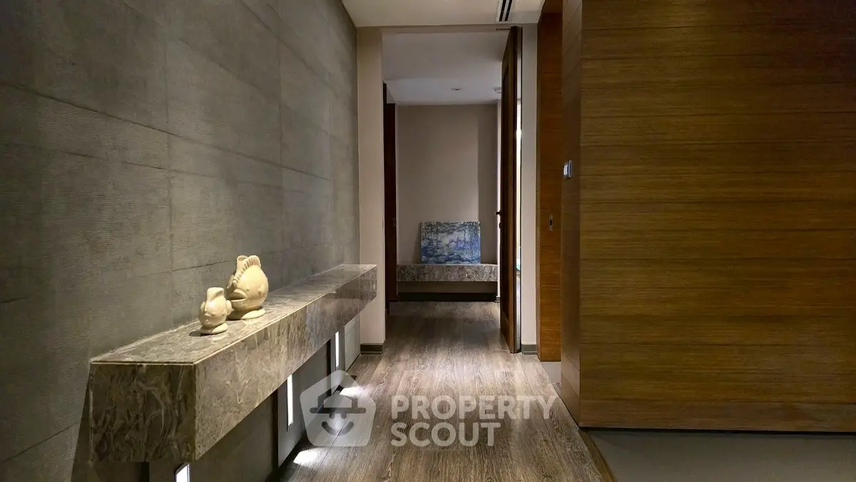 Elegant hallway with modern decor and ambient lighting in luxury apartment
