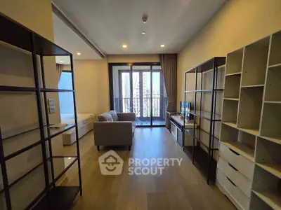 Spacious modern living room with balcony view in high-rise apartment