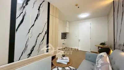 Modern living room with stylish marble accent wall and cozy seating area