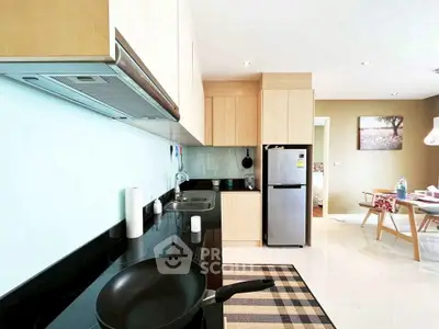 Modern kitchen with sleek appliances and open layout, perfect for culinary enthusiasts.