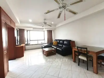 Spacious living room with modern furniture and ceiling fans