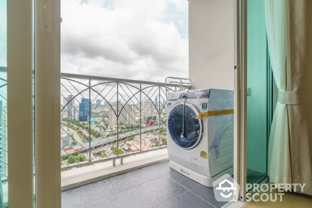 Modern balcony with city view and washing machine, perfect for urban living.