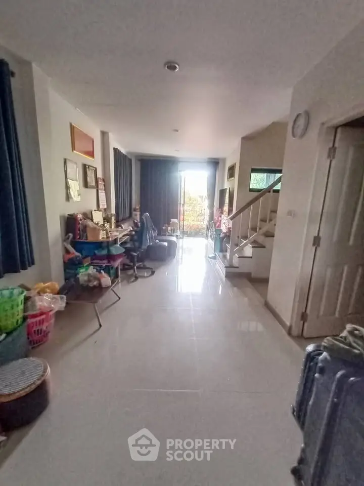 Spacious living room with natural light and modern decor