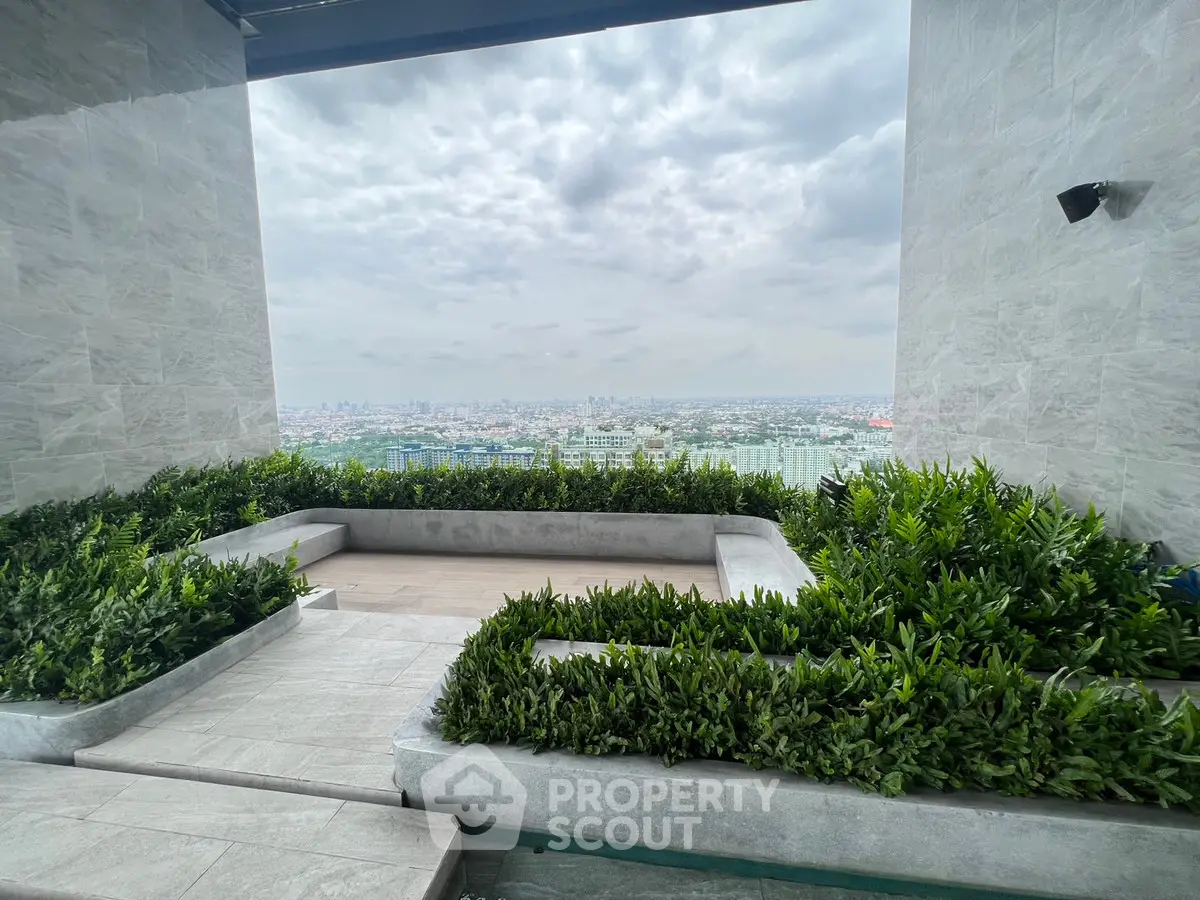 Stunning rooftop garden with panoramic city view, perfect for relaxation and entertainment.